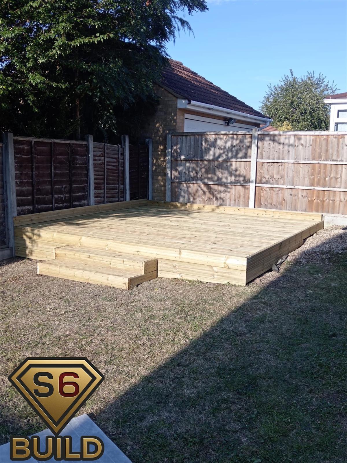 Raised pressure-treated timber decking platform with integrated steps