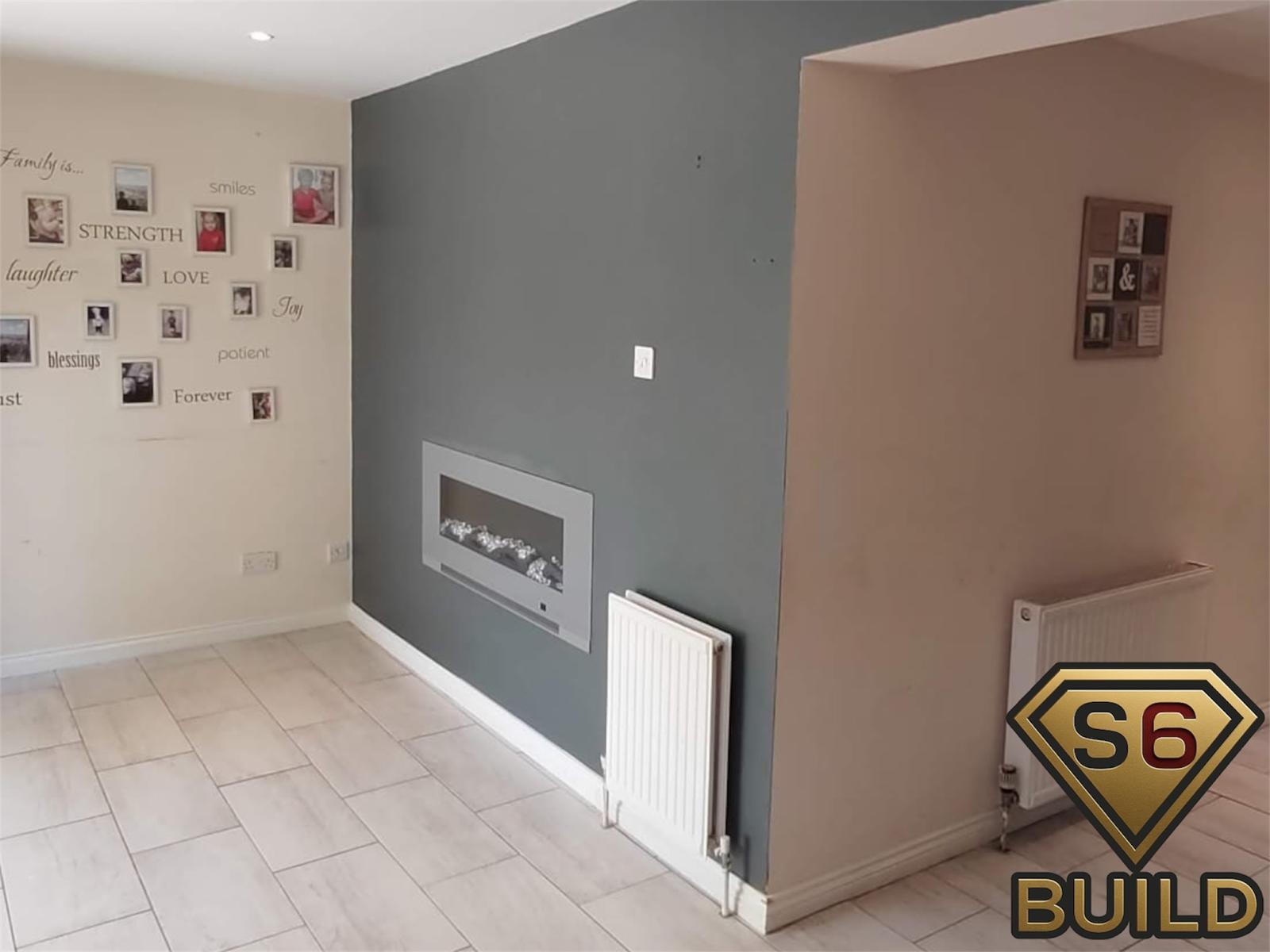 Graphite feature wall with compact inset electric fireplace