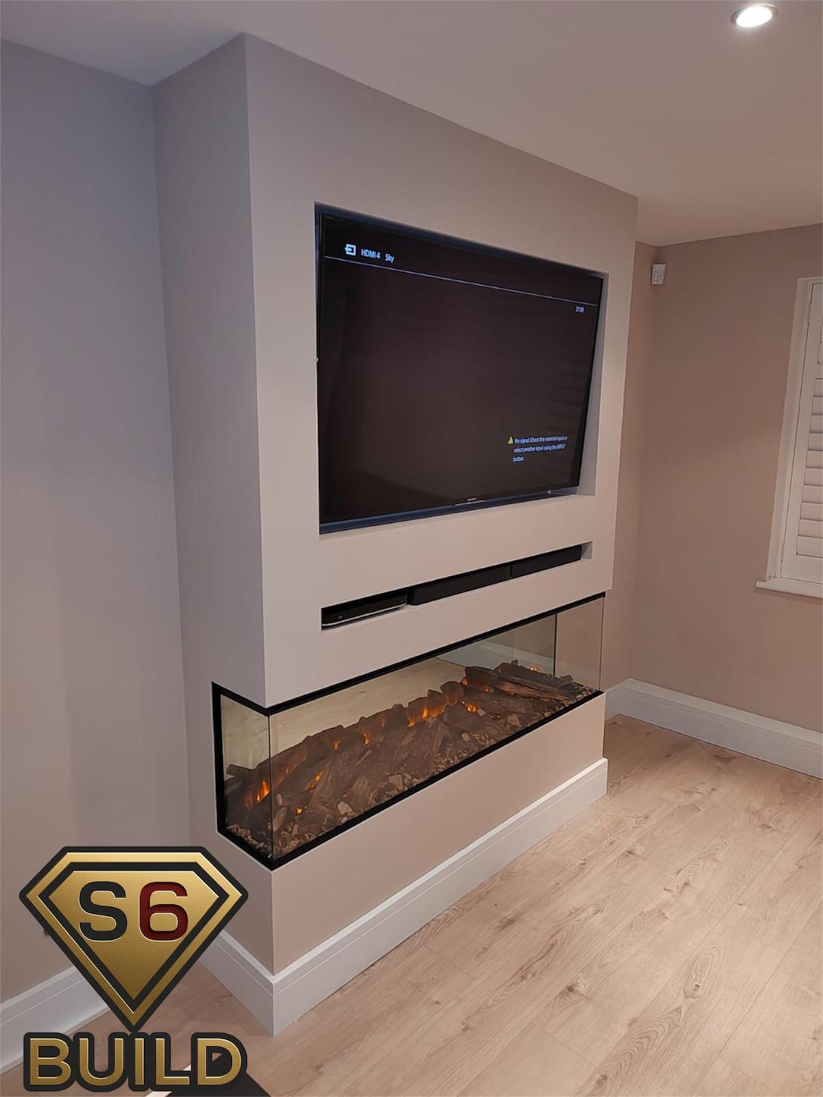 Compact corner media wall with recessed television and two-sided electric fire