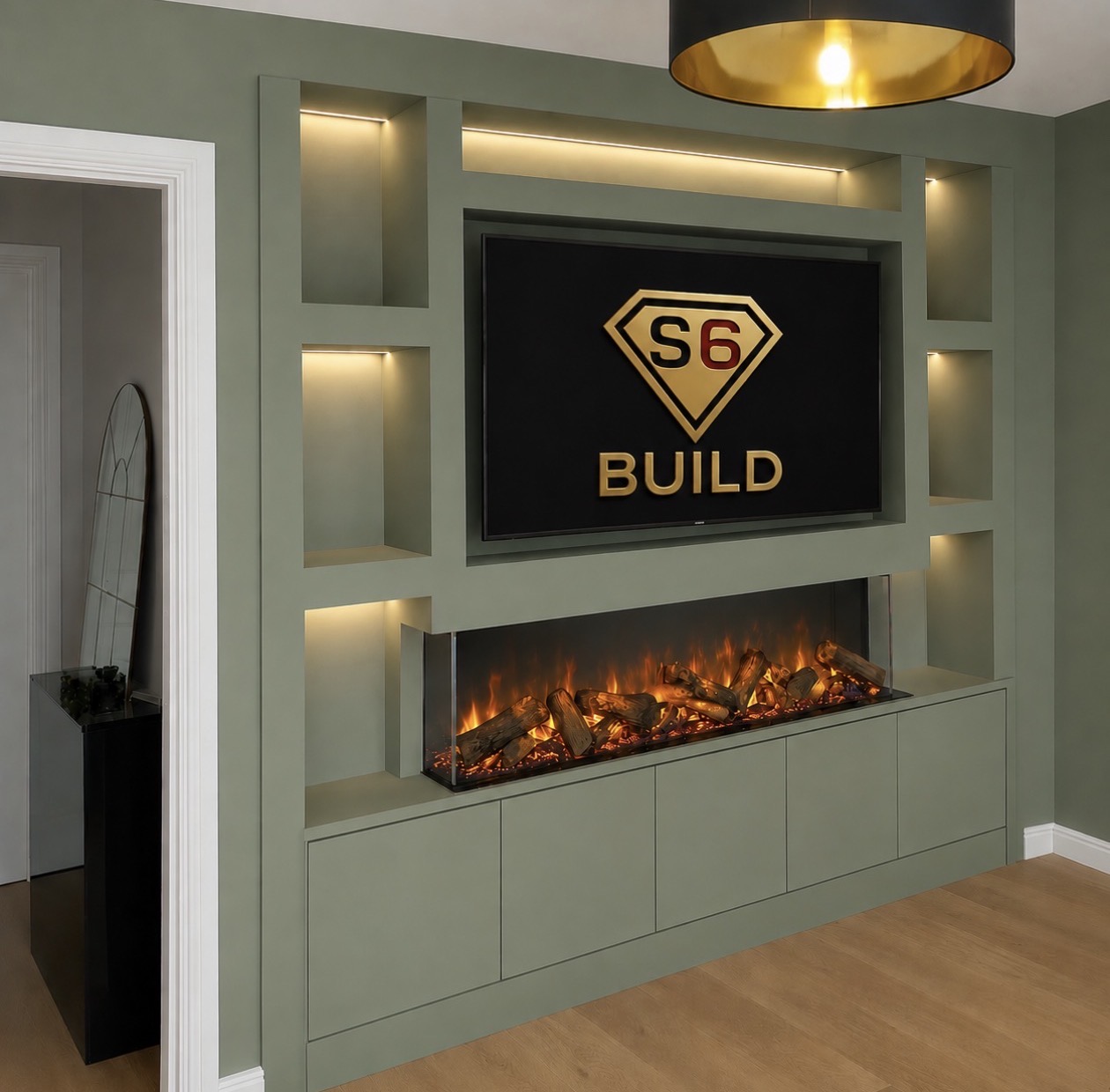 Painted media wall with recessed television, electric fire and lower cabinetry