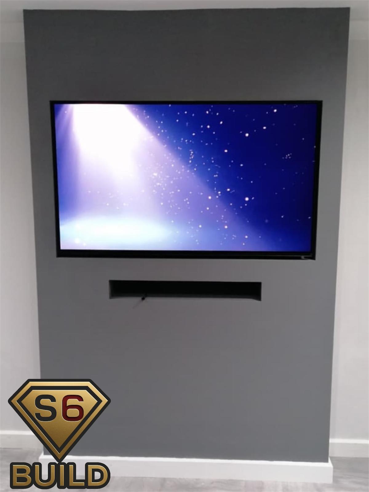 Compact grey TV wall with recessed television and soundbar opening